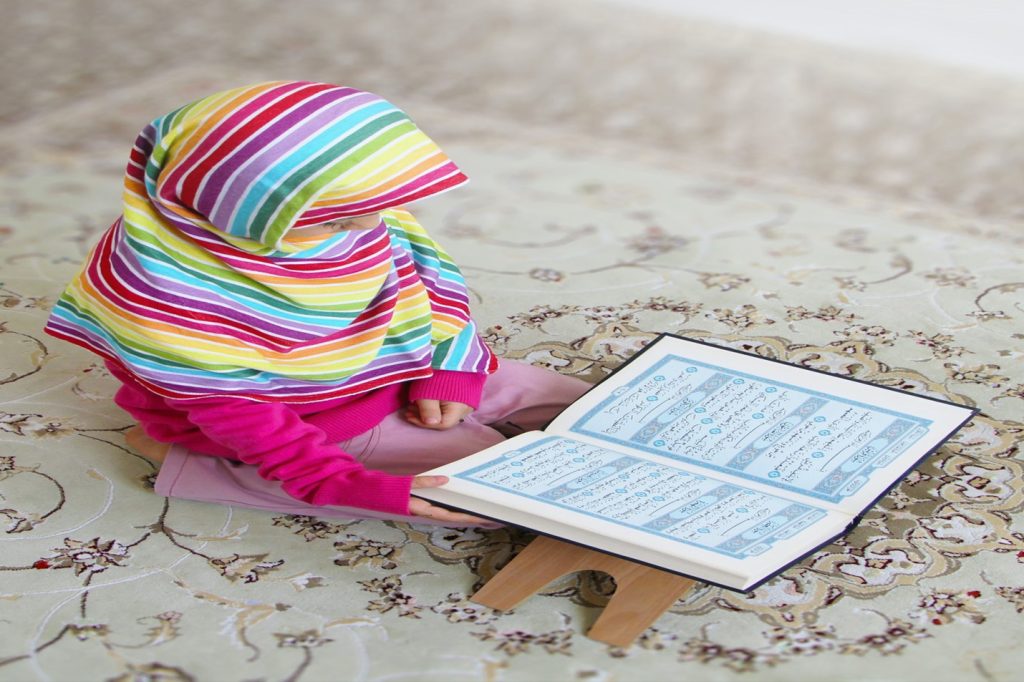A girl who is reading the Quran