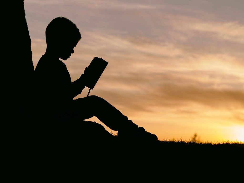 Reading Quranic stories by a child