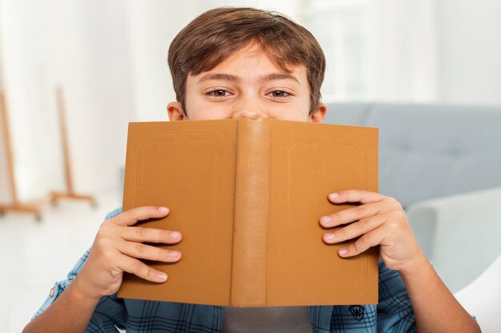 front-view-boy-home-reading 23-2148355245