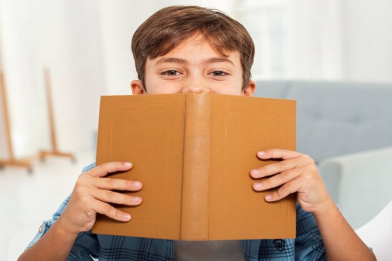 front-view-boy-home-reading 23-2148355245