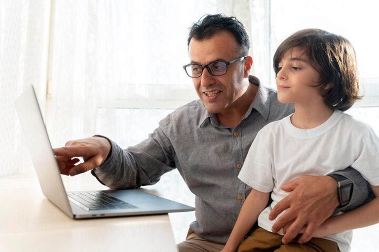 father-son-playing-something-laptop 23-2149126752