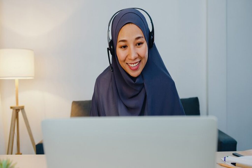 muslim-lady-wear-headphone-watch-webinar-listen-online-course-communicate-by-conference-video-call-night-home-office 7861-3016-(2)